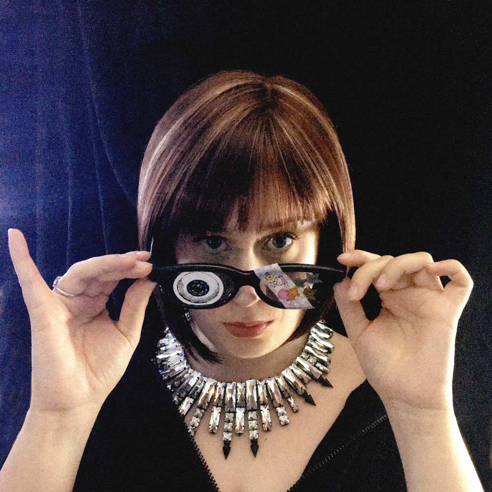 Singer Caryl Archer with glasses pulled down